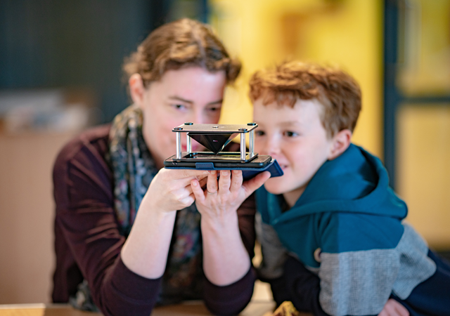 The appliance of science - visitors to a Night At Your Museum can create handheld holograms using a 3D hologram projection pyramid.