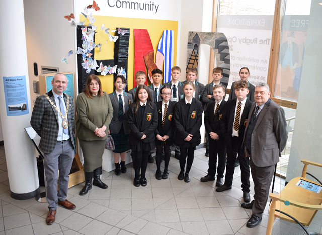 Students from Houlton and Harris secondary schools joined (left to right) the Mayor of Rugby, Cllr Simon Ward, Cllr Maggie O'Rourke, Rugby Borough Council portfolio holder for partnerships and wellbeing, and Cllr Neil Sandison, the council's Liberal Democrat spokesperson for partnerships and wellbeing, at the Holocaust Memorial Day display at Rugby Art Gallery and Museum.