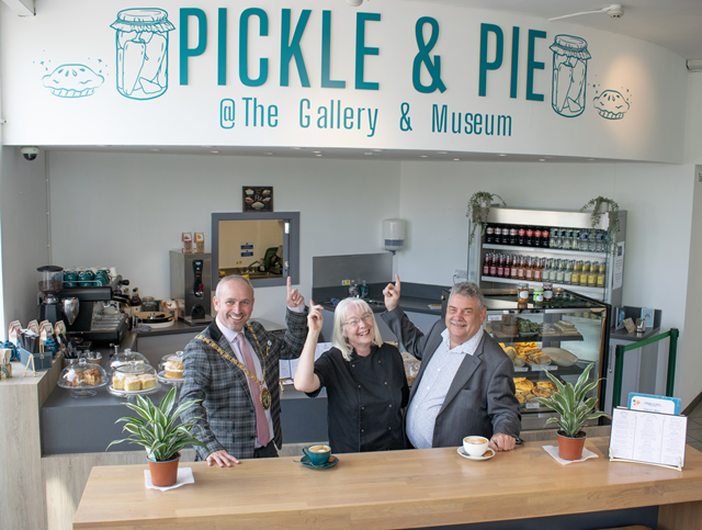 (left to right) The Mayor of Rugby, Cllr Simon Ward, Pickle & Pie's Lisa Styles and Cllr Neil Sandison, Rugby Borough Council's Liberal Democrat group spokesperson for partnerships and wellbeing, at Rugby Art Gallery and Museum's new café.