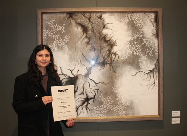 Rugby Open 24 winner Anya Kalsi with her painting, Echoes of Entanglement.