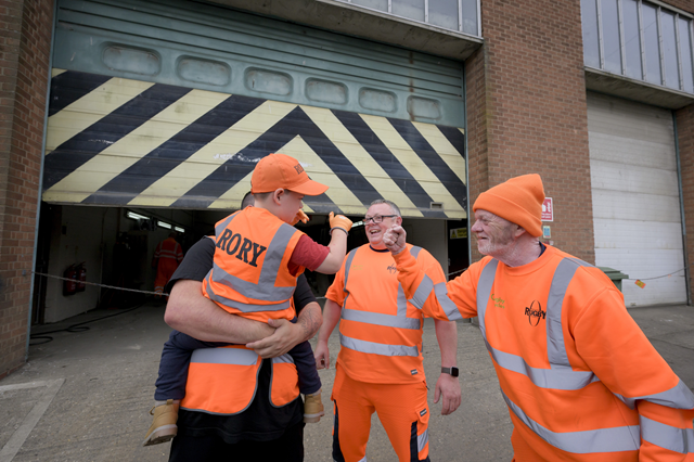 Rory and dad Shane meet Darren (left) and Snowy (right) at the council's Work Services Unit.