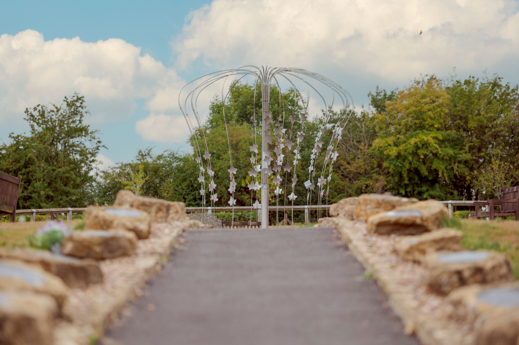 Image of a path outside leading to a sculpture