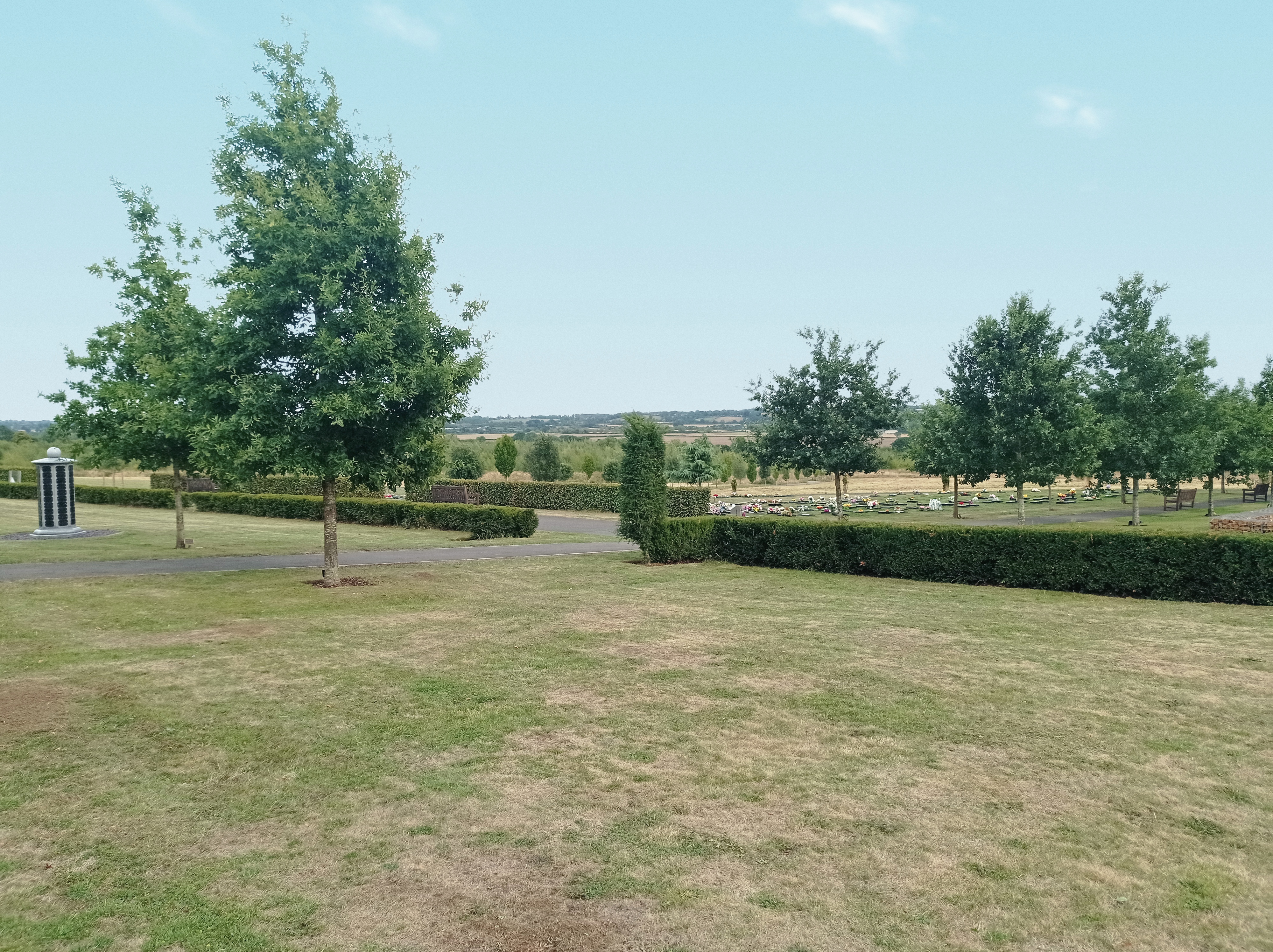 Picture of trees and hedges outside the cemetery
